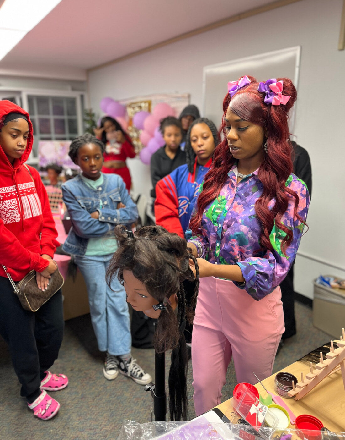 Jada'Marie teaching students at Teen Braid Camp